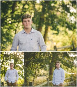 Senior boy standing in front of the fall foliage at Robin Hill Park near Pittsburgh