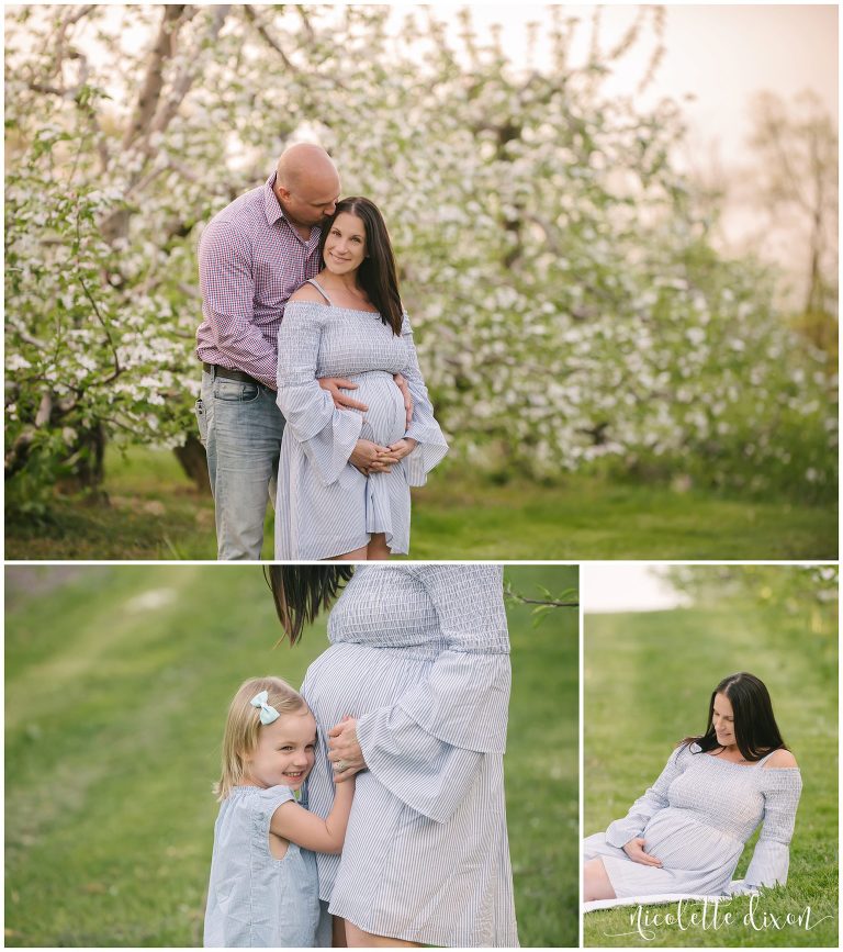 Husband kissing pregnant wife on the cheek at Soergel Orchard in Wexford near Pittsburgh