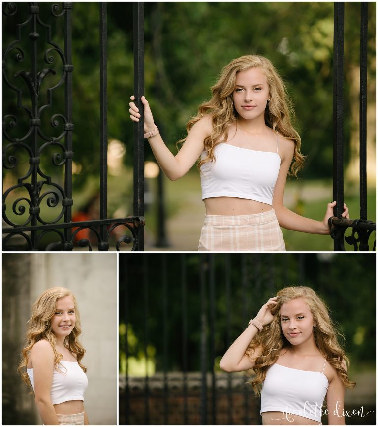 High school senior girl standing by gate at Mellon Park near Pittsburgh