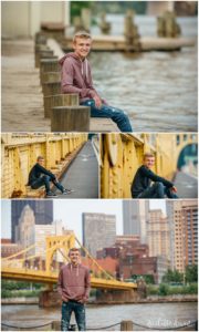 Young man poses against bridge near downtown Pittsburgh, PA