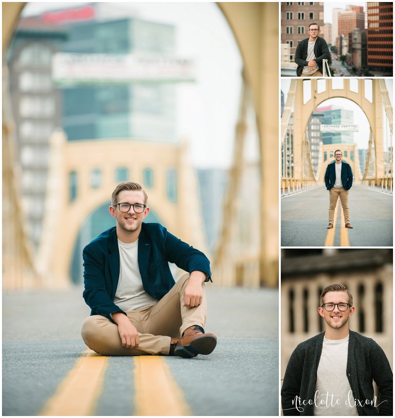 High school senior boy sits in the middle of a bridge in downtown Pittsburgh