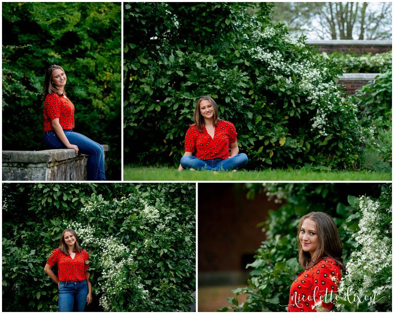 High school senior stands amidst flowers and trees in Greensboro North Carolina