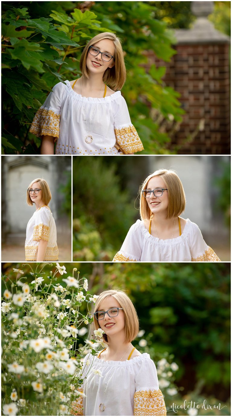 High School Senior Girl Standing next to Flowers in Greensboro NC