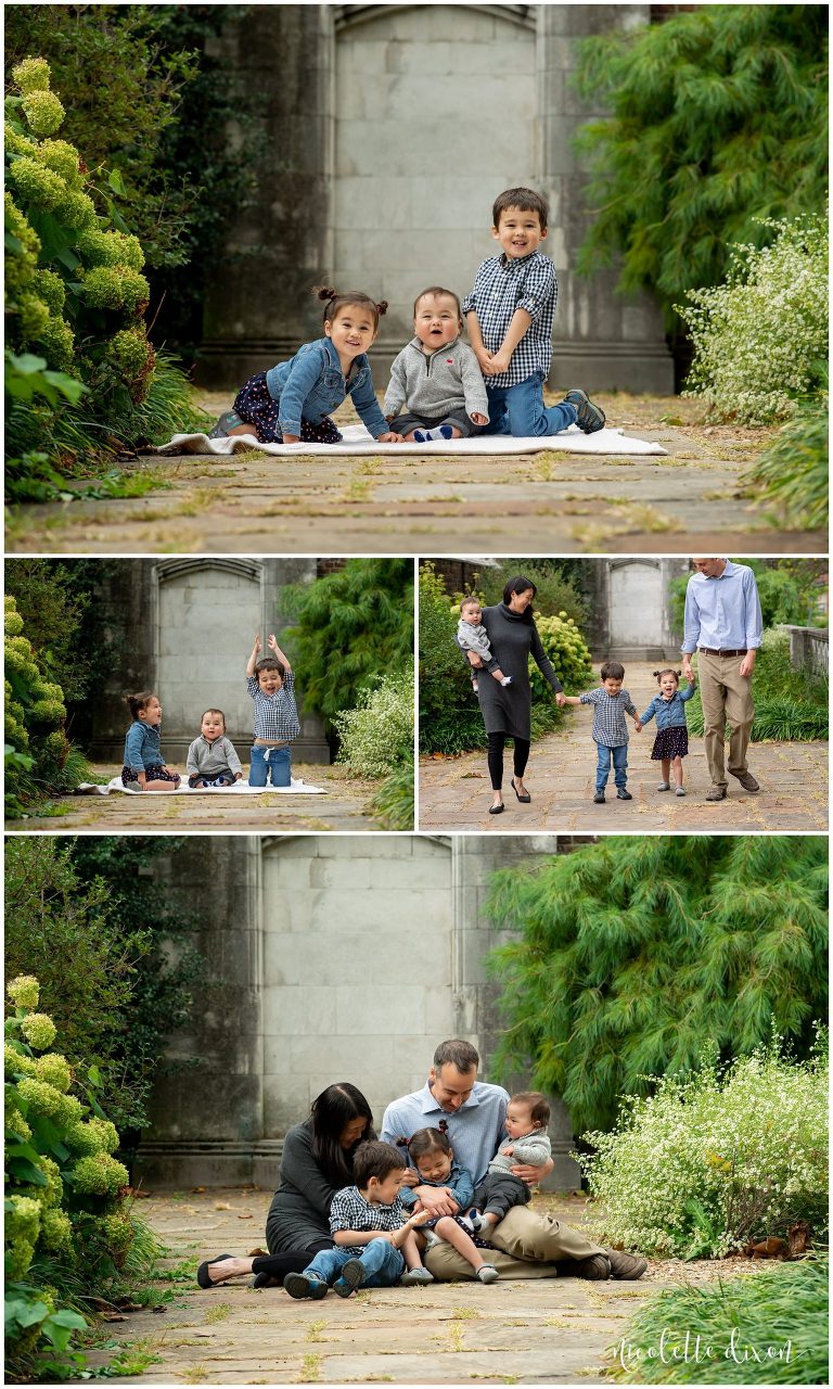 Family sitting on the ground in the walled garden at Mellon Park near Pittsburgh