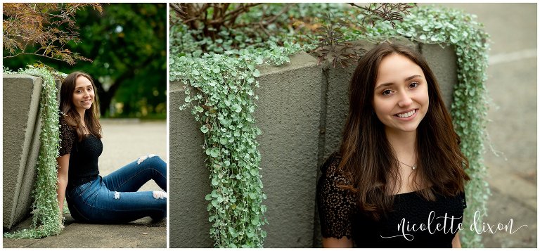 High school senior girl sitting next to plant in Mellon Park near Pittsburgh