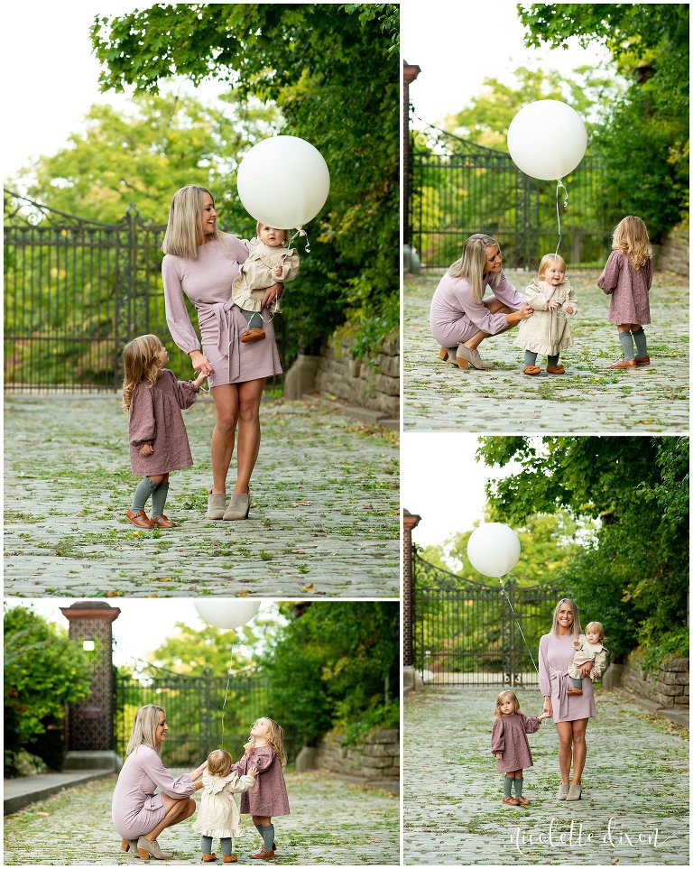 Mom playing with a ballon with her daughters at Mellon Park near Pittsburgh