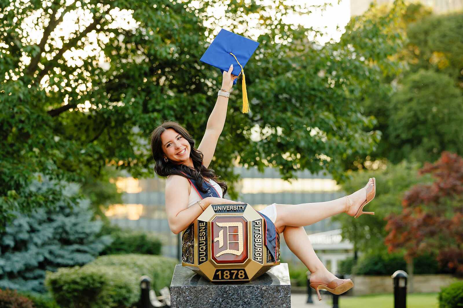 College graduate sitting in ring at Duquesne University in Pittsburgh