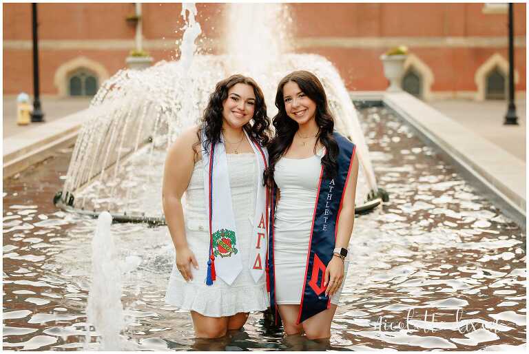 College Graduates Standing in Fountain on Duquesne University Campus in Pittsburgh